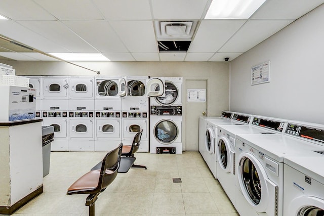 laundry room with separate washer and dryer and stacked washer / drying machine