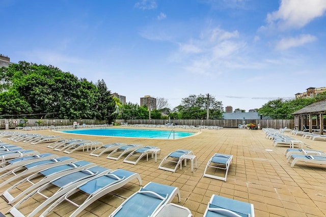 view of swimming pool featuring a patio area