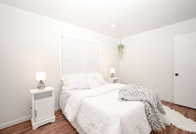 bedroom featuring hardwood / wood-style flooring