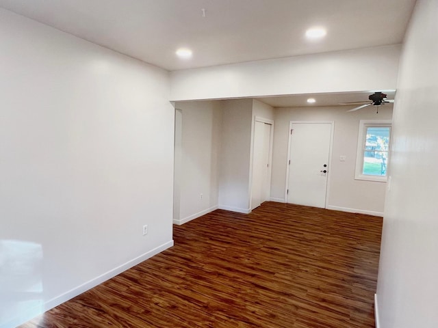 spare room featuring ceiling fan and dark hardwood / wood-style floors