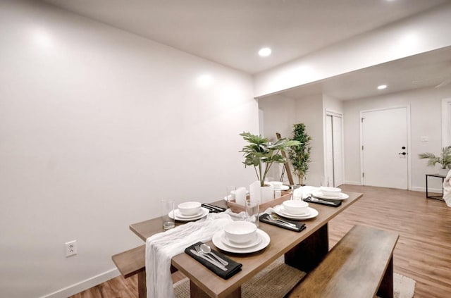 dining area featuring light wood-type flooring