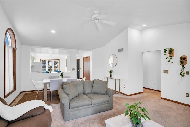 living room with baseboards, visible vents, light colored carpet, vaulted ceiling, and recessed lighting