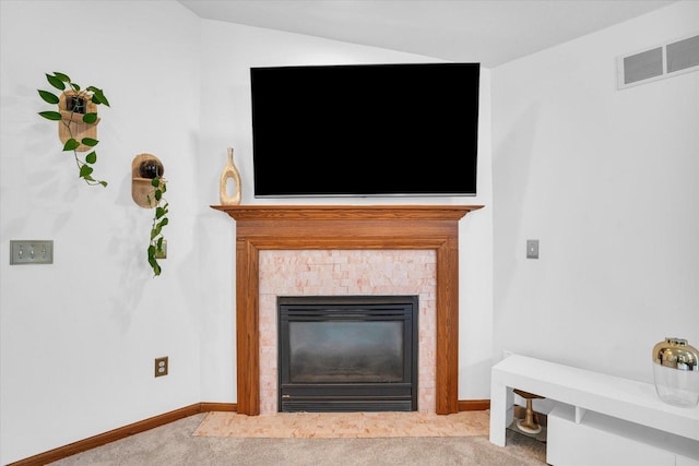 room details with carpet, visible vents, baseboards, and a tile fireplace