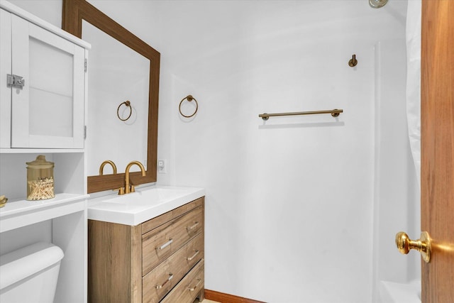 bathroom with vanity and toilet