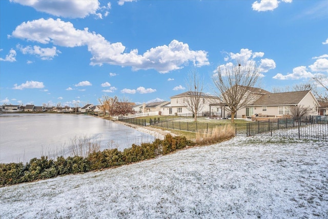 water view with a residential view and fence