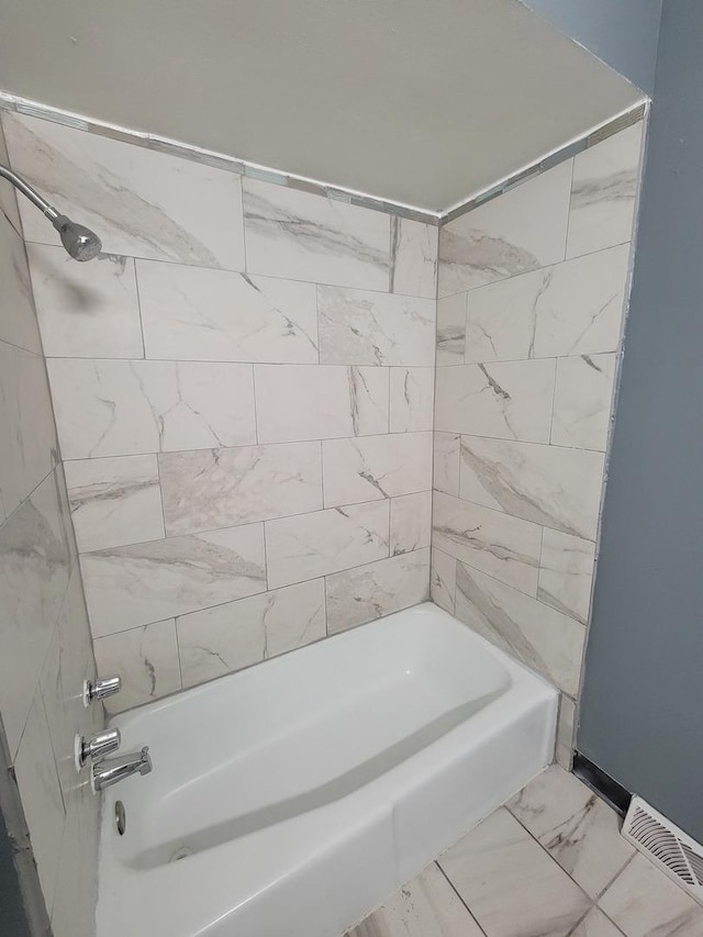 bathroom with shower / bath combination