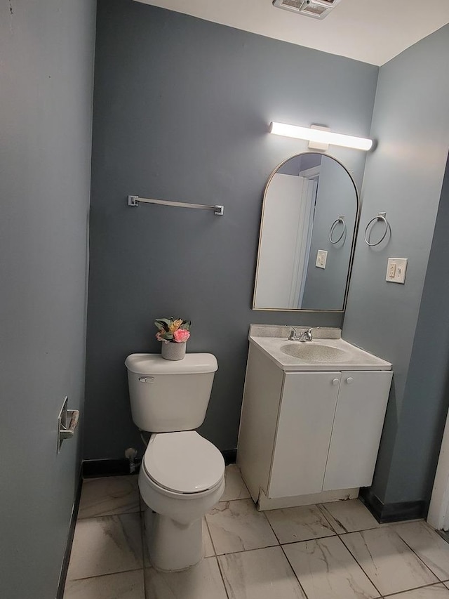 bathroom with toilet and vanity