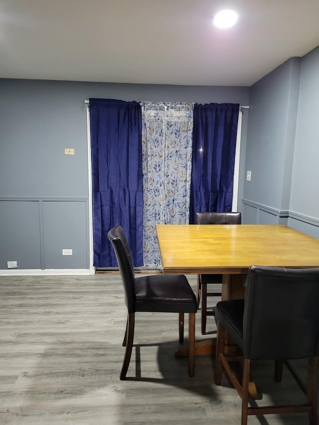 dining space featuring hardwood / wood-style flooring