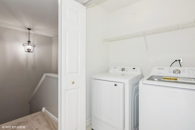 washroom with washing machine and dryer