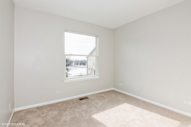 view of carpeted spare room