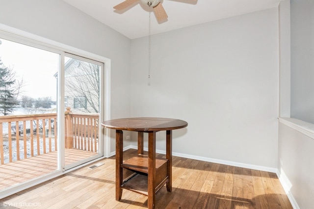 dining area featuring hardwood / wood-style floors and ceiling fan