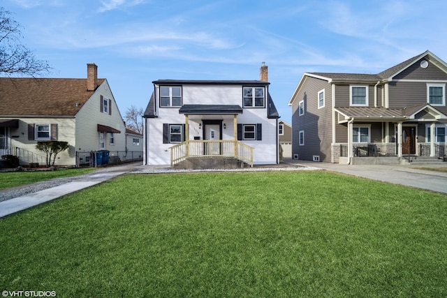 view of front of home featuring a chimney and a front lawn