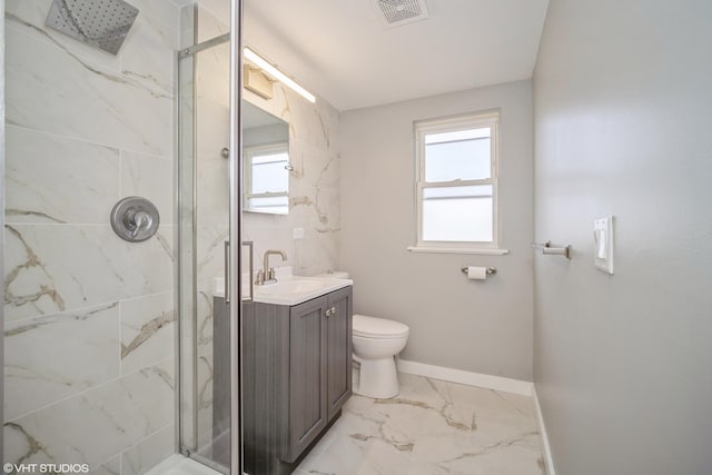 bathroom featuring vanity, baseboards, a marble finish shower, visible vents, and marble finish floor