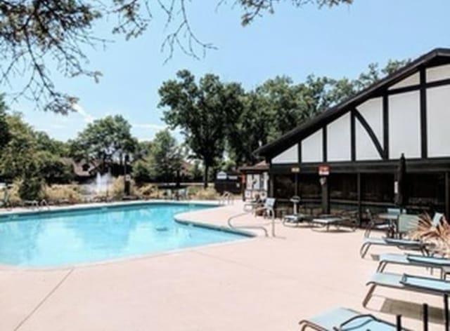 view of pool featuring a patio