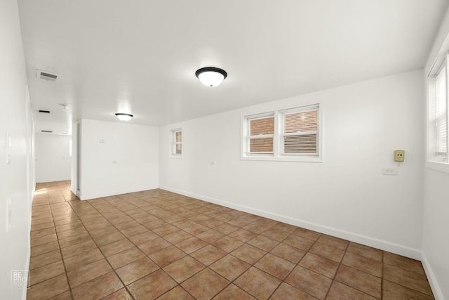 unfurnished room featuring tile patterned floors