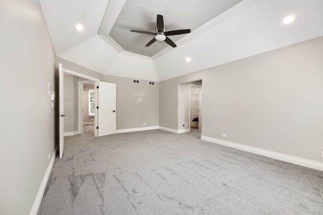 unfurnished bedroom featuring light carpet, recessed lighting, baseboards, and lofted ceiling