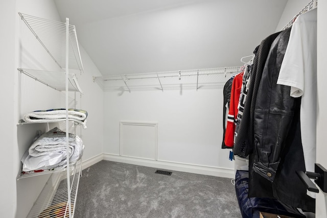 walk in closet featuring carpet