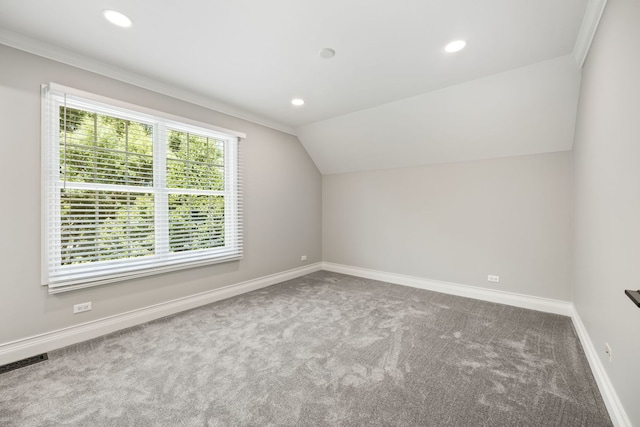 additional living space with visible vents, baseboards, carpet floors, recessed lighting, and vaulted ceiling