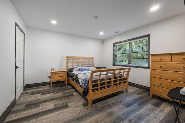 bedroom with recessed lighting and wood finished floors