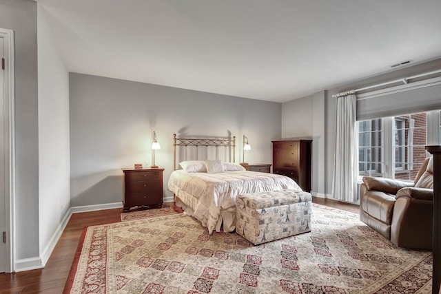 bedroom with hardwood / wood-style flooring