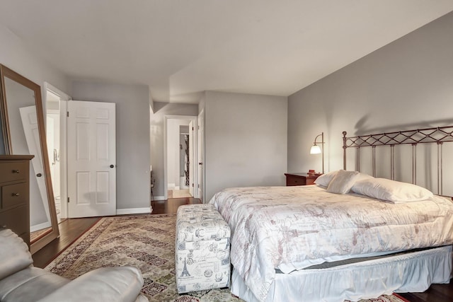 bedroom featuring dark wood-type flooring