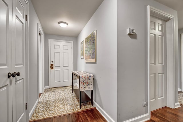 hall with dark hardwood / wood-style flooring