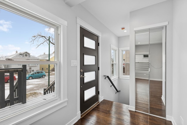 entryway with dark wood-type flooring