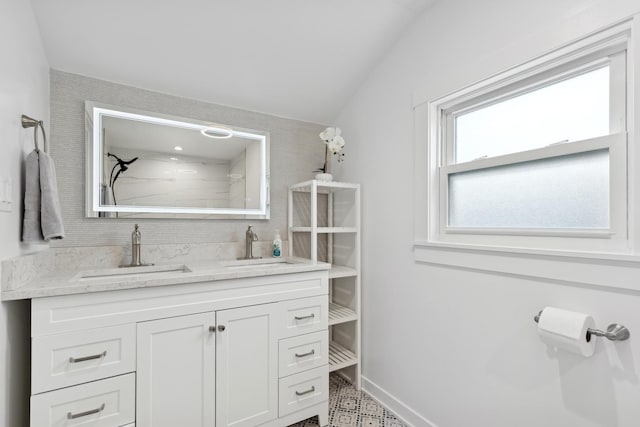 bathroom featuring walk in shower and vanity