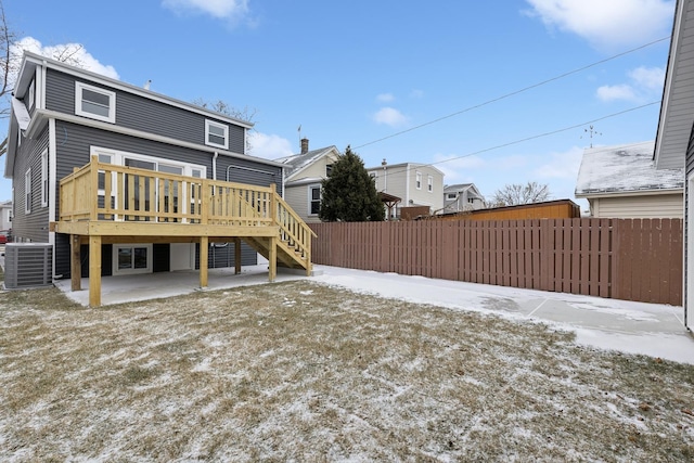 back of property with a patio, cooling unit, and a deck