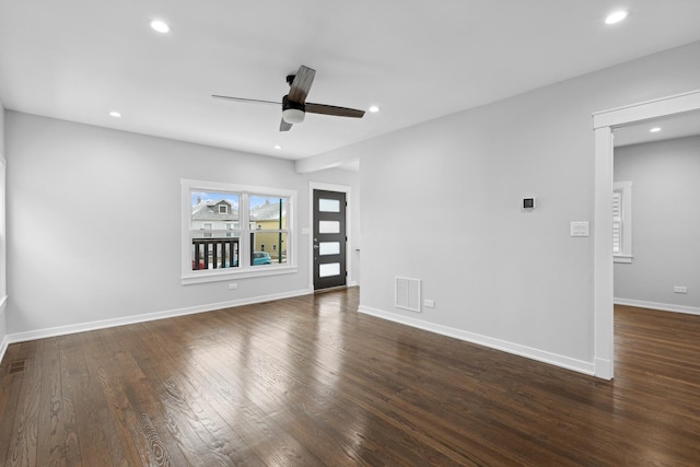 unfurnished room featuring ceiling fan and dark hardwood / wood-style flooring