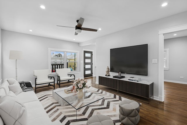 living room with ceiling fan and wood-type flooring