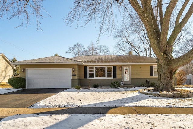 single story home with a garage