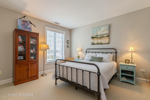 bedroom with light carpet