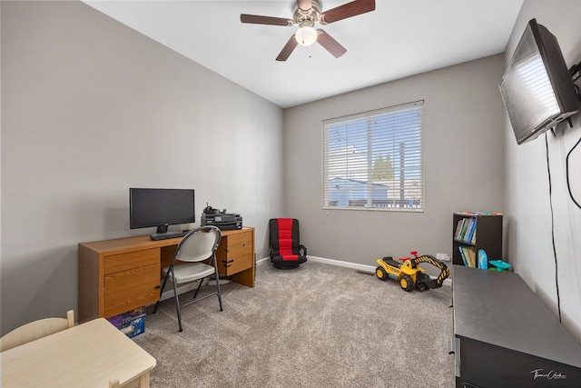 home office with light carpet and ceiling fan