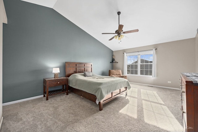 bedroom featuring ceiling fan, light colored carpet, and lofted ceiling