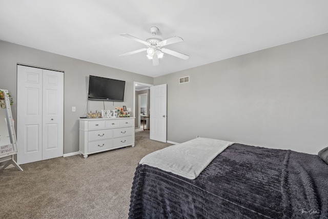 carpeted bedroom with a closet and ceiling fan