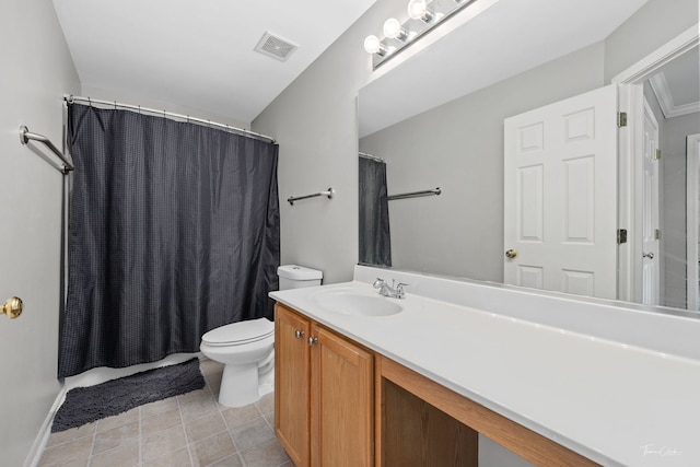 bathroom featuring toilet, vanity, and a shower with curtain