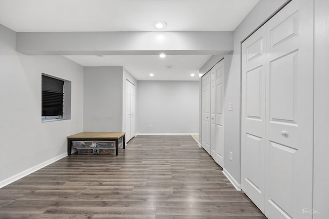 hallway with dark hardwood / wood-style flooring