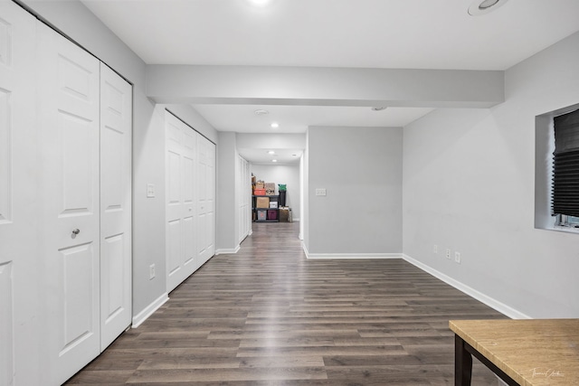 corridor with dark hardwood / wood-style floors