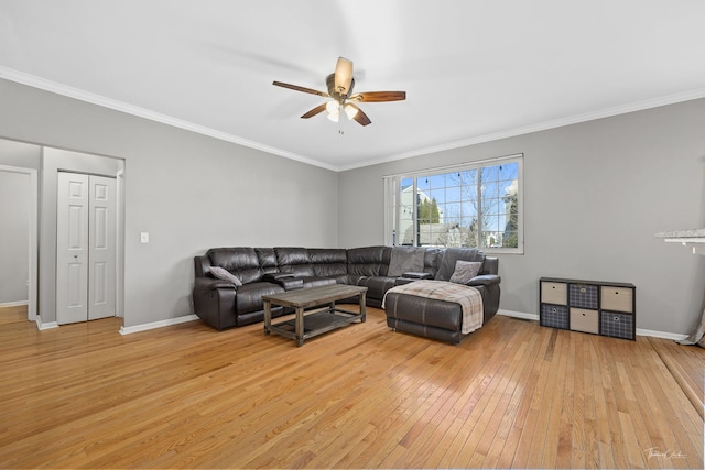 living room with ceiling fan, light hardwood / wood-style flooring, and crown molding