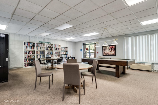 dining room with a paneled ceiling and carpet flooring