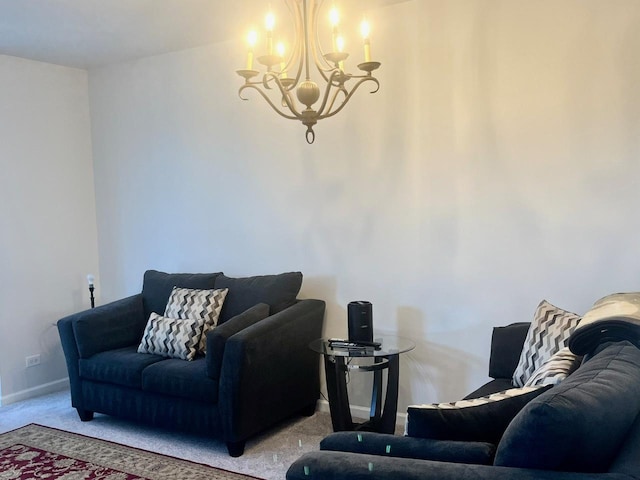 carpeted living room featuring an inviting chandelier