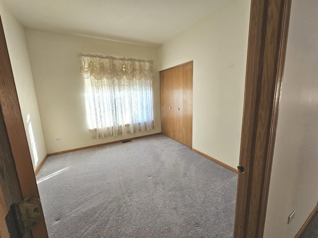 empty room with carpet flooring