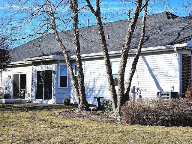 view of property exterior featuring a lawn