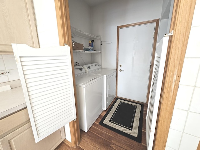 washroom featuring dark hardwood / wood-style floors and independent washer and dryer