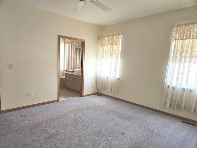 carpeted empty room with ceiling fan