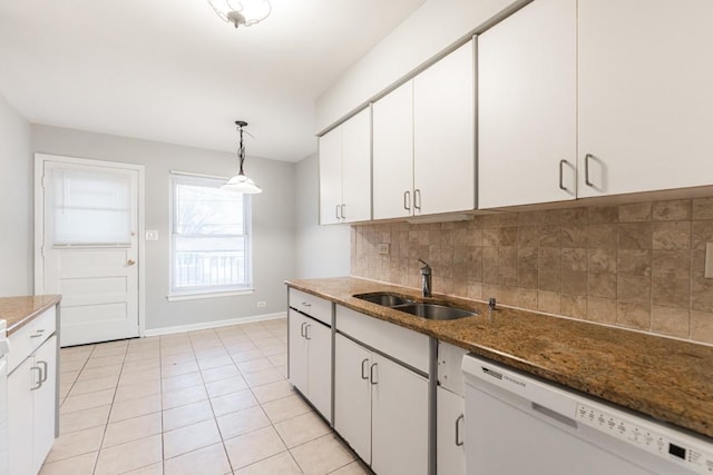 kitchen with decorative light fixtures, white cabinets, dishwasher, and sink