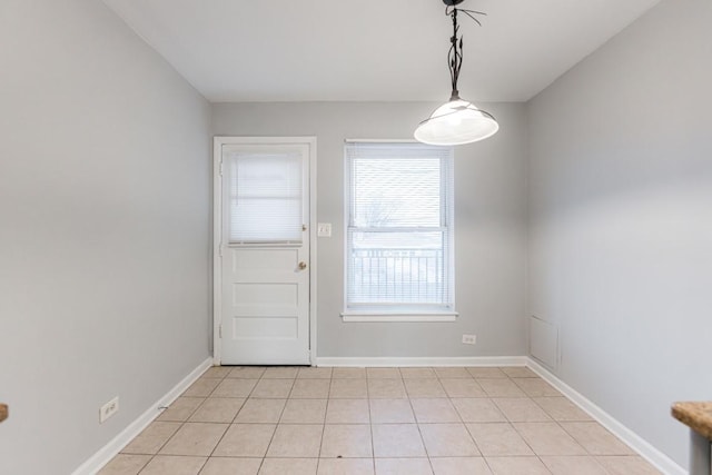 doorway to outside featuring light tile patterned floors