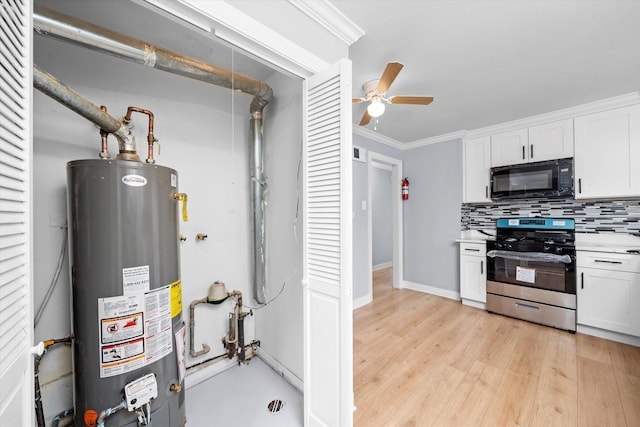 utility room featuring gas water heater and visible vents