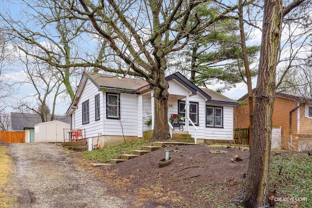 view of front of house with a shed